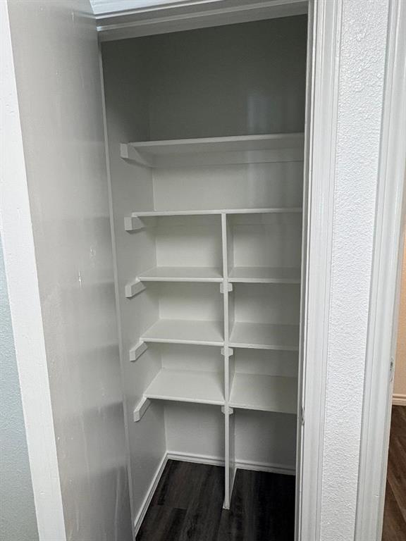 7060 Jay Lane Azle, TX 76020 - Photo 7 of 36 a view of walk in closet with empty racks