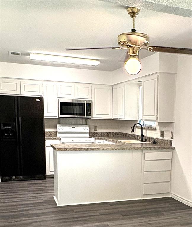 7060 Jay Lane Azle, TX 76020 - Photo 8 of 36 a view of a kitchen with a sink stainless steel appliances and cabinets