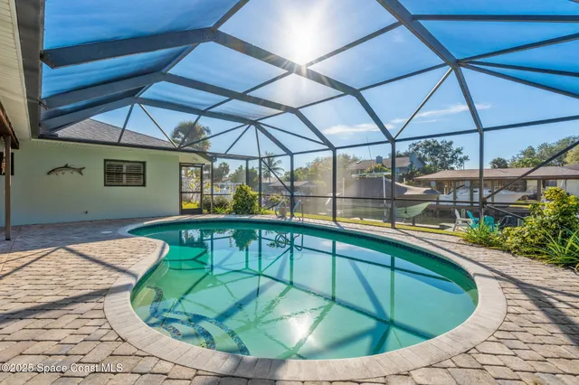 a view of a swimming pool with a patio