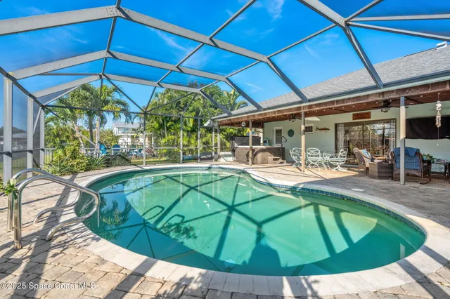 a view of a swimming pool with a patio