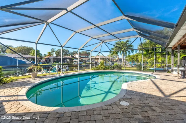 a view of a swimming pool with a patio