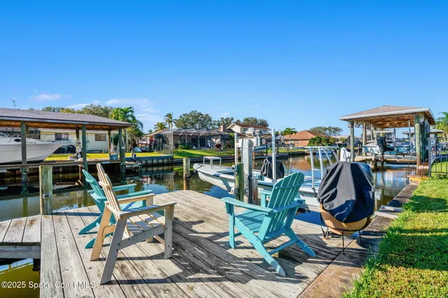 a view of a chairs and table in patio