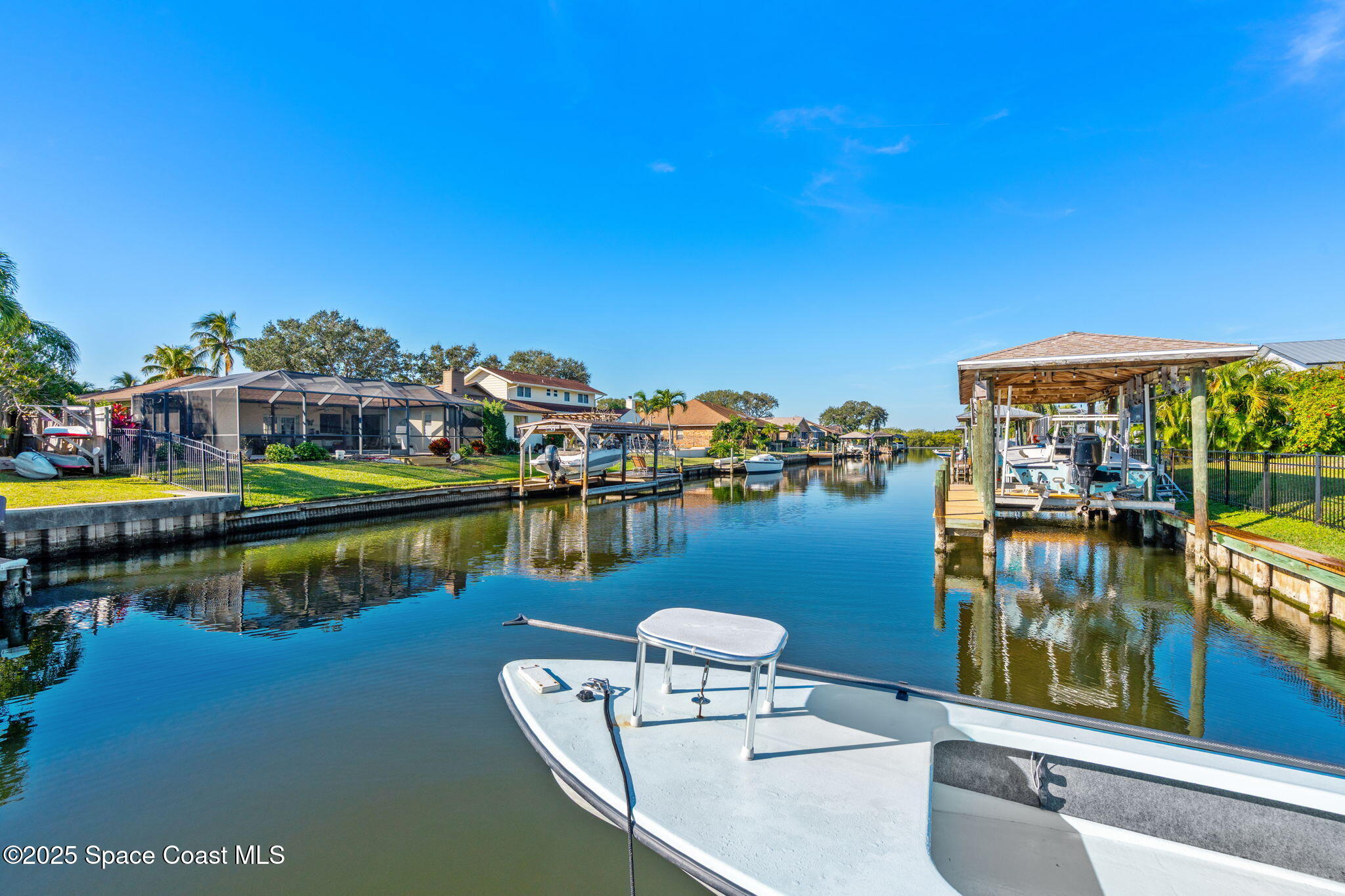 615 Mark And Randy Drive Satellite Beach, FL 32937 - Photo 4 of 40 a view of a lake with a house