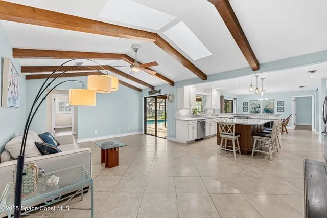 an aerial view of residential houses with outdoor space and parking