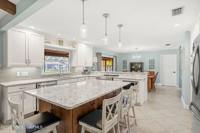 a dining table with chairs and window