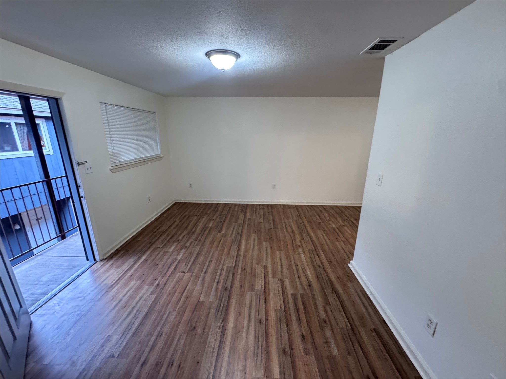 8207 Sam Rayburn Drive, Unit 204 Austin, TX 78753 - Photo 2 of 27 wooden floor in a hall with an entryway