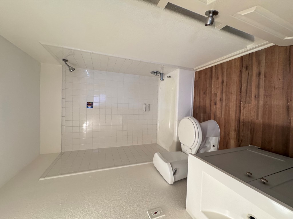 8207 Sam Rayburn Drive, Unit 204 Austin, TX 78753 - Photo 5 of 8 a bathroom with a sink a toilet and shower