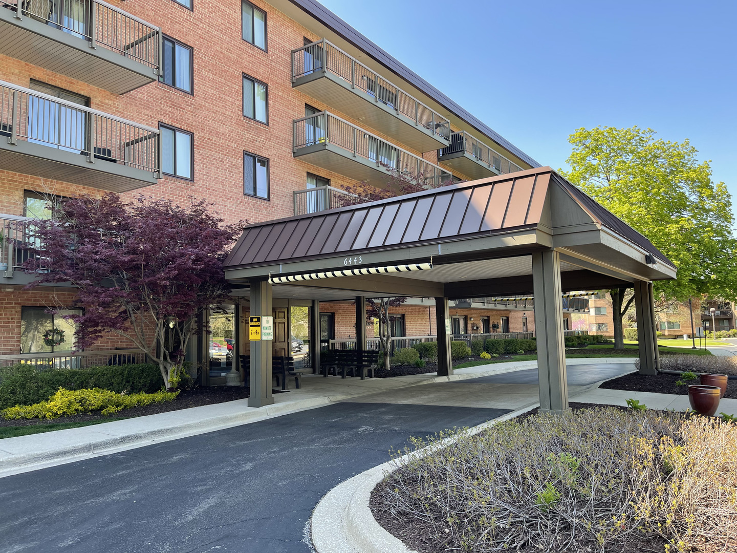 a front view of a building with street view