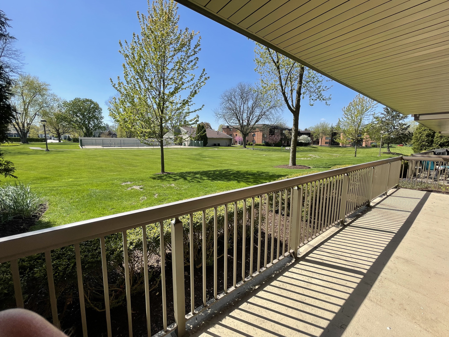 6443 Clarendon Hills Road, Unit 107 Willowbrook, IL 60527 - Photo 14 of 19 a view of a wooden deck
