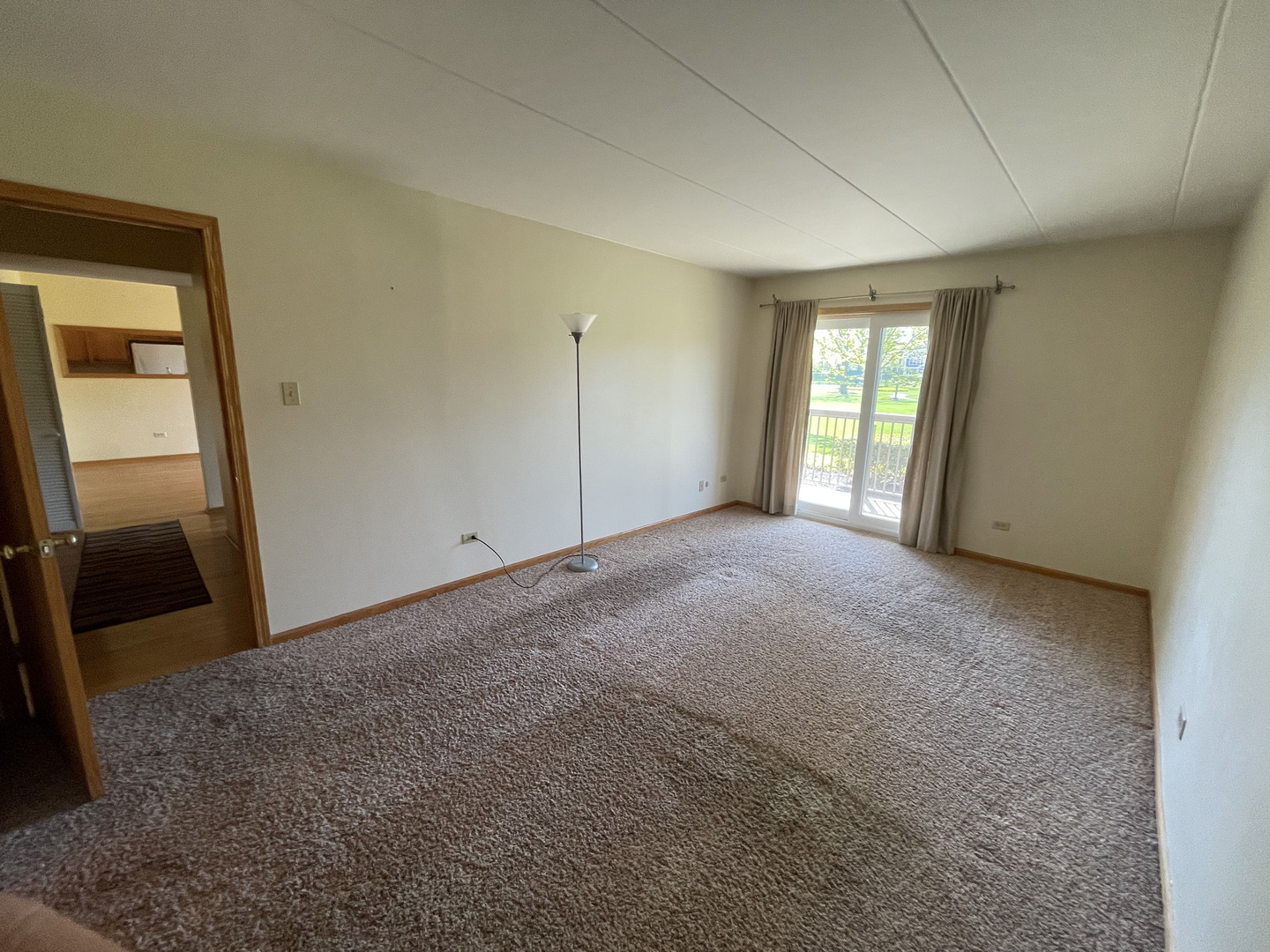 6443 Clarendon Hills Road, Unit 107 Willowbrook, IL 60527 - Photo 7 of 19 a view of an empty room and a window