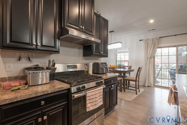 a view of a dining room with furniture and windows