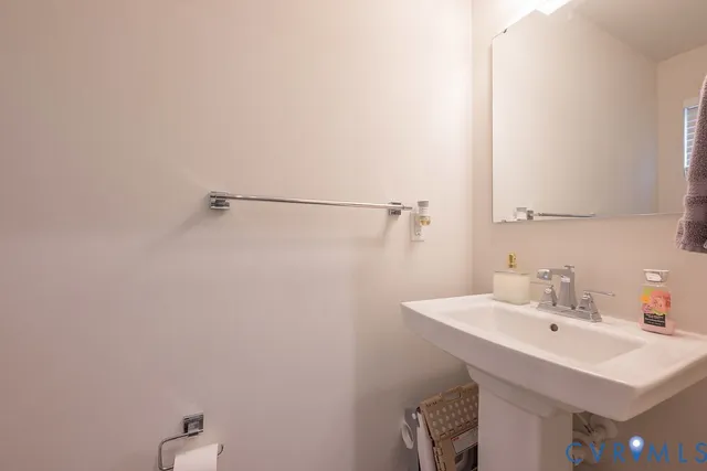 a view of a hallway with wooden floor and closet