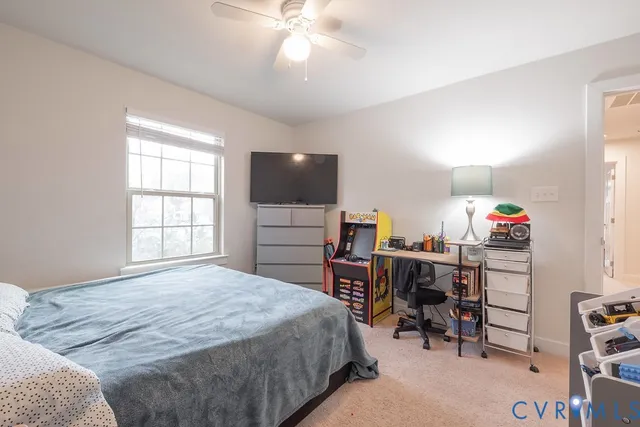 a bathroom with a double vanity sink toilet and a mirror