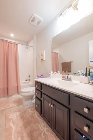 a bedroom with two beds and a window