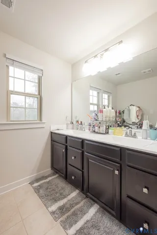 a bathroom with a shower and a sink