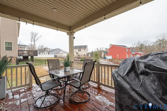 a view of a big house with a big yard and large trees