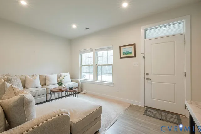 a living room with furniture and a window