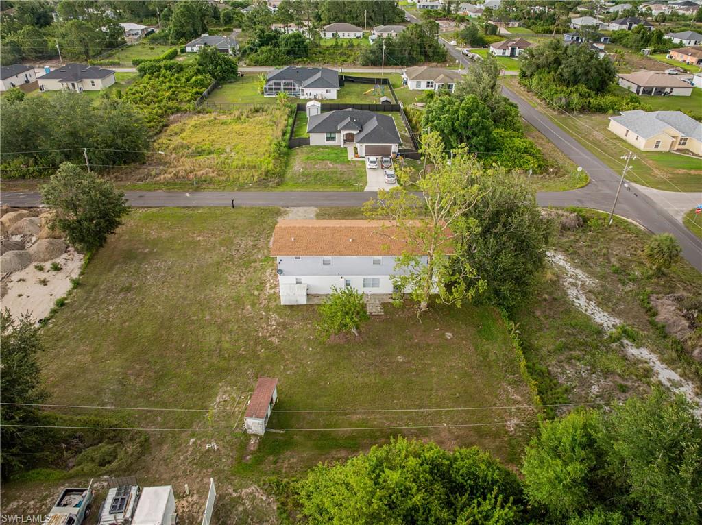 3303 6th Street Southwest Lehigh Acres, FL 33976 - Photo 22 of 23 an aerial view of residential houses with outdoor space