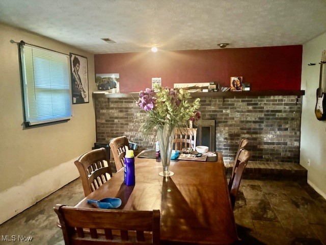 3077 Anderson Anthony Road Northwest Warren, OH 44481 - Photo 8 of 31 Family room featuring a textured ceiling and brick gas fireplace.