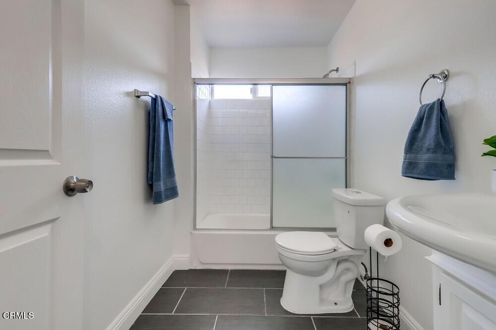 140 East 101st Street Los Angeles, CA 90003 - Photo 12 of 22 a bathroom with a toilet and a shower