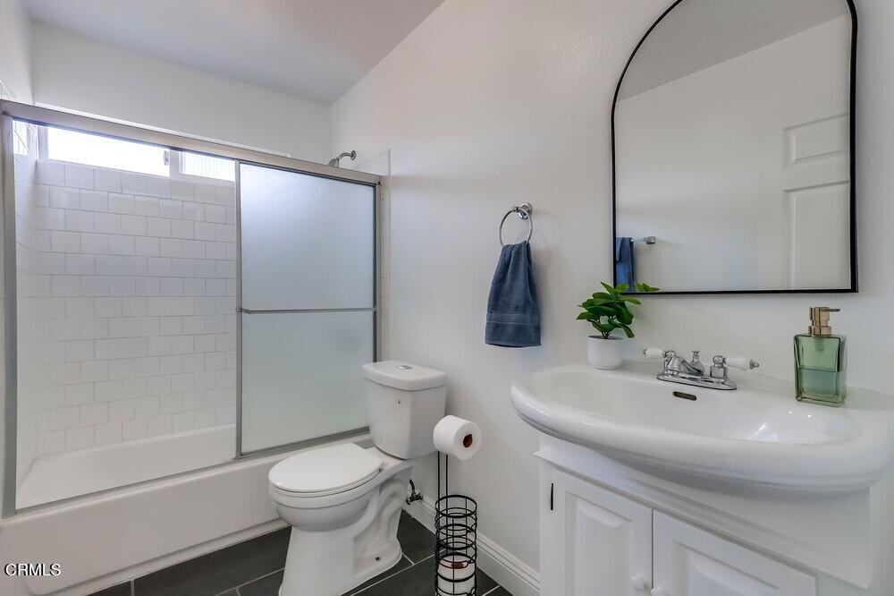 140 East 101st Street Los Angeles, CA 90003 - Photo 15 of 22 a bathroom with a sink toilet and shower