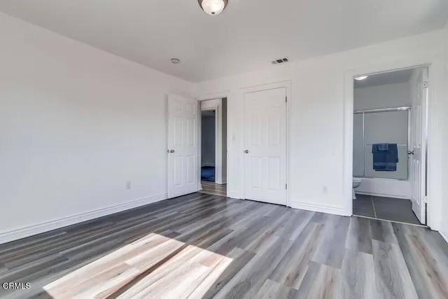 a view of an empty room and glass door