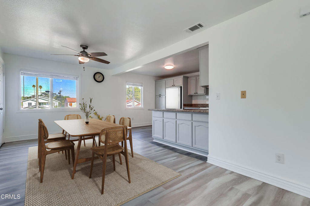 140 East 101st Street Los Angeles, CA 90003 - Photo 6 of 22 a view of a dining room with furniture and a kitchen