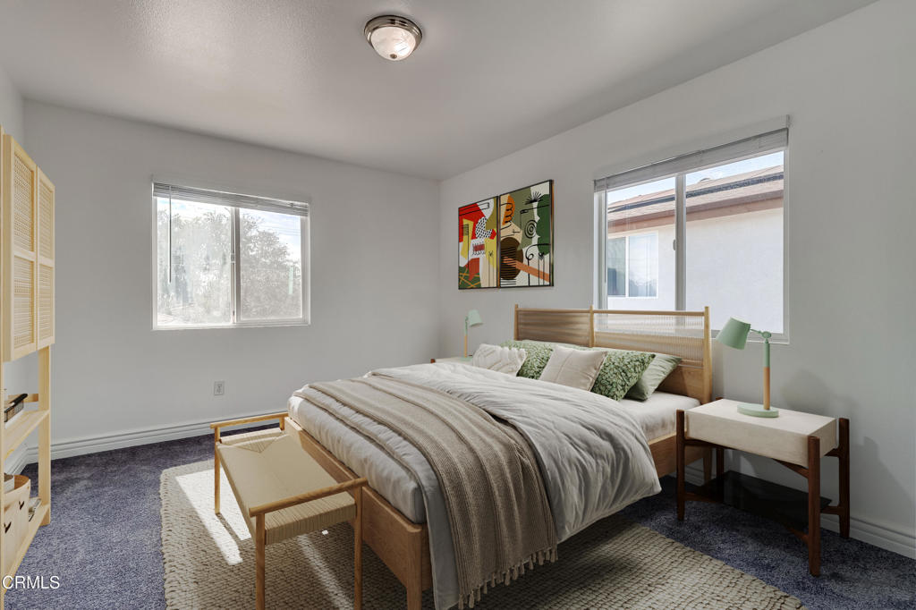 140 East 101st Street Los Angeles, CA 90003 - Photo 10 of 22 a bedroom with a bed and a window