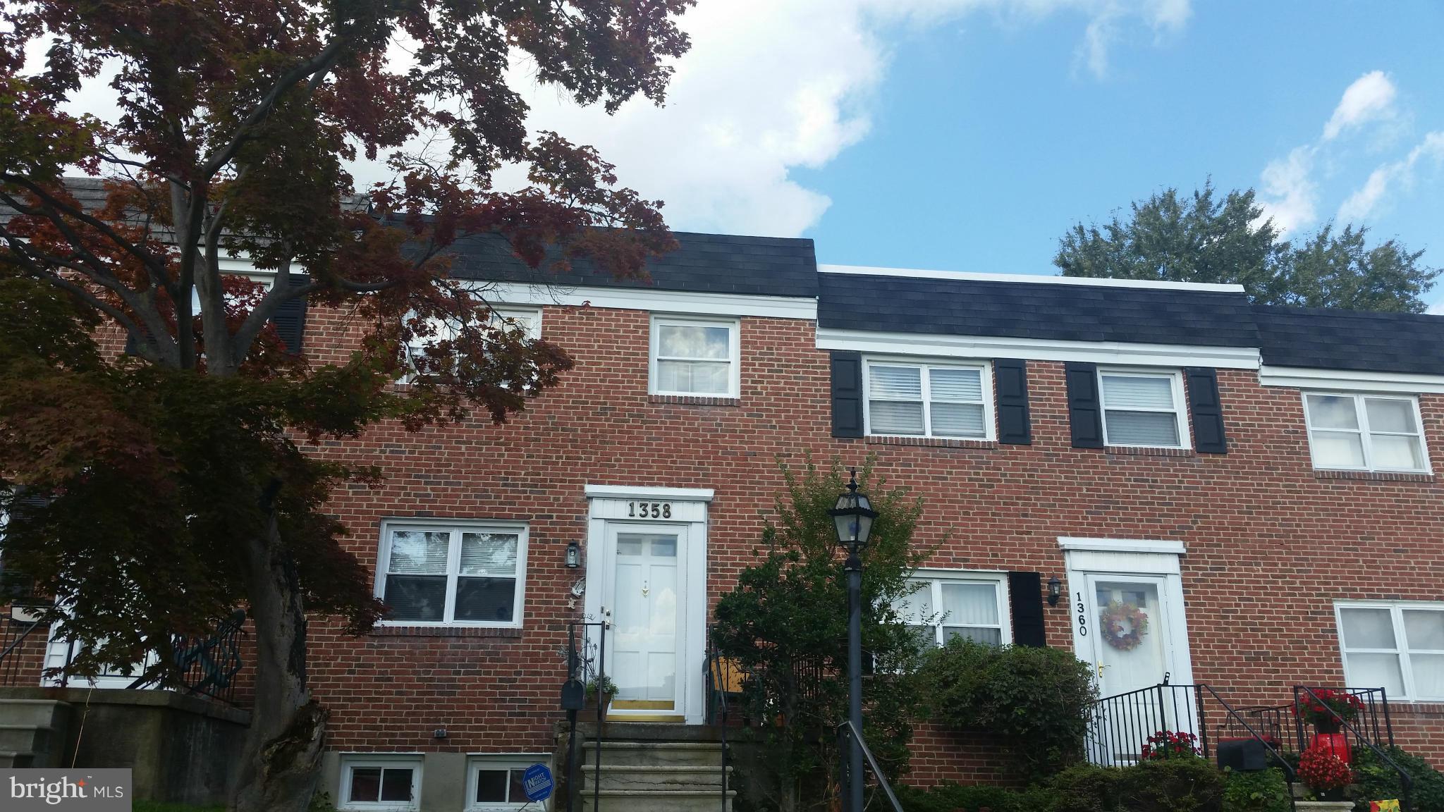 1358 Halstead Road Parkville, MD 21234 - Photo 1 of 9 a front view of a house with plants and trees