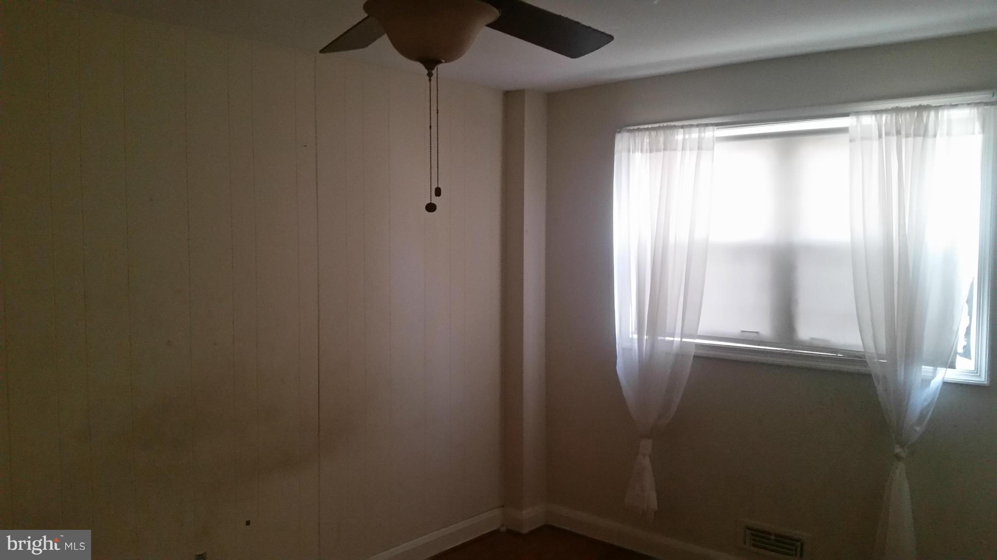 1358 Halstead Road Parkville, MD 21234 - Photo 6 of 9 a view of empty room with window