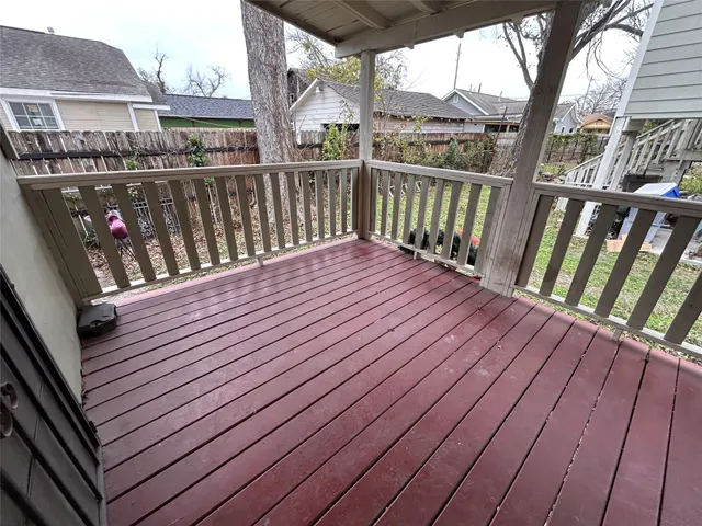 a balcony with wooden floor