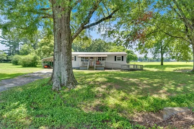 a view of a house with a big yard