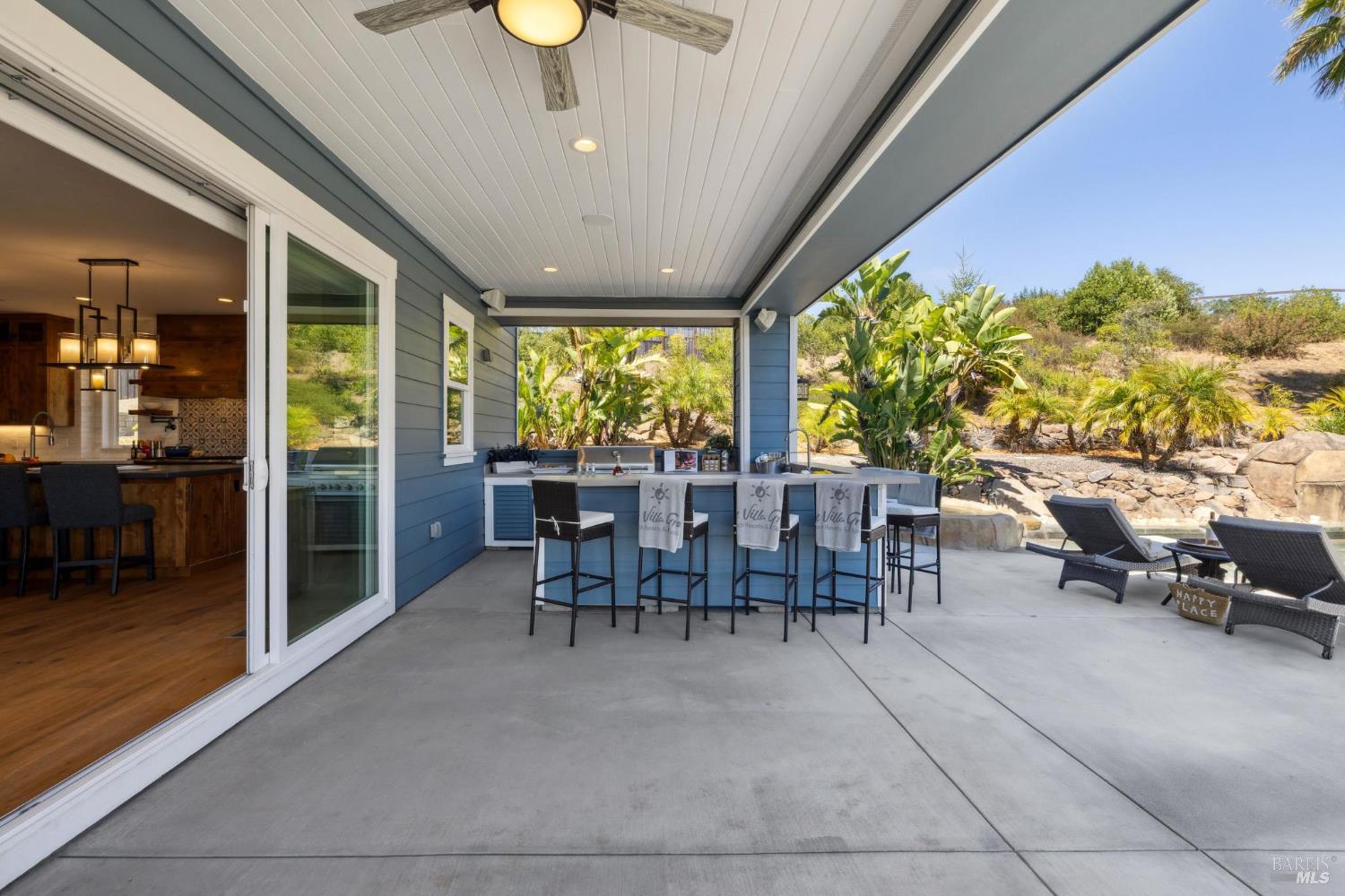3882 Royal Manor Place Santa Rosa, CA 95404 - Photo 29 of 98 The spacious backyard is set with a KitchenAid BBQ that has natural gas run to it so you wont need to fill propane tanks, bar seating for 8, outdoor refrigerator, outdoor sink, and plenty of open and shaded seating area.