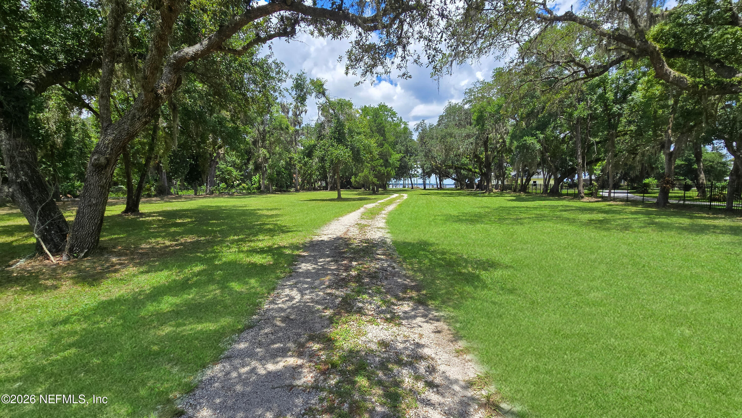 12638 Mandarin Road Jacksonville, FL 32223 - Photo 16 of 33 a big yard with lots of green space and trees