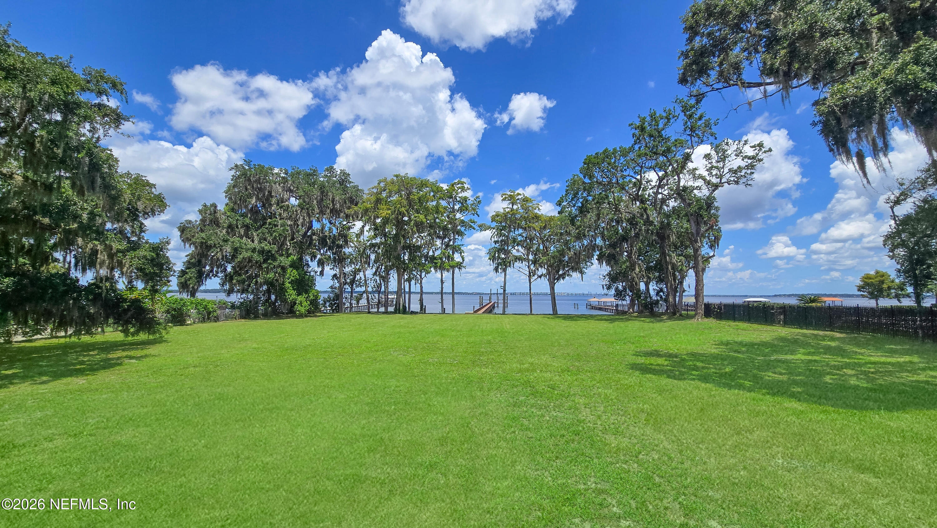 12638 Mandarin Road Jacksonville, FL 32223 - Photo 7 of 33 a view of a big yard with plants and large trees