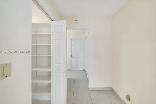 a view of an empty room with a window