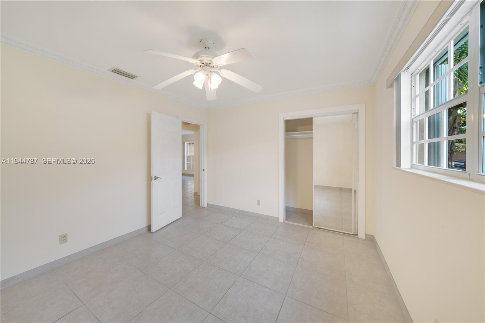 5524 Cleveland Street Hollywood, FL 33021 - Photo 22 of 36 a view of an empty room with a window