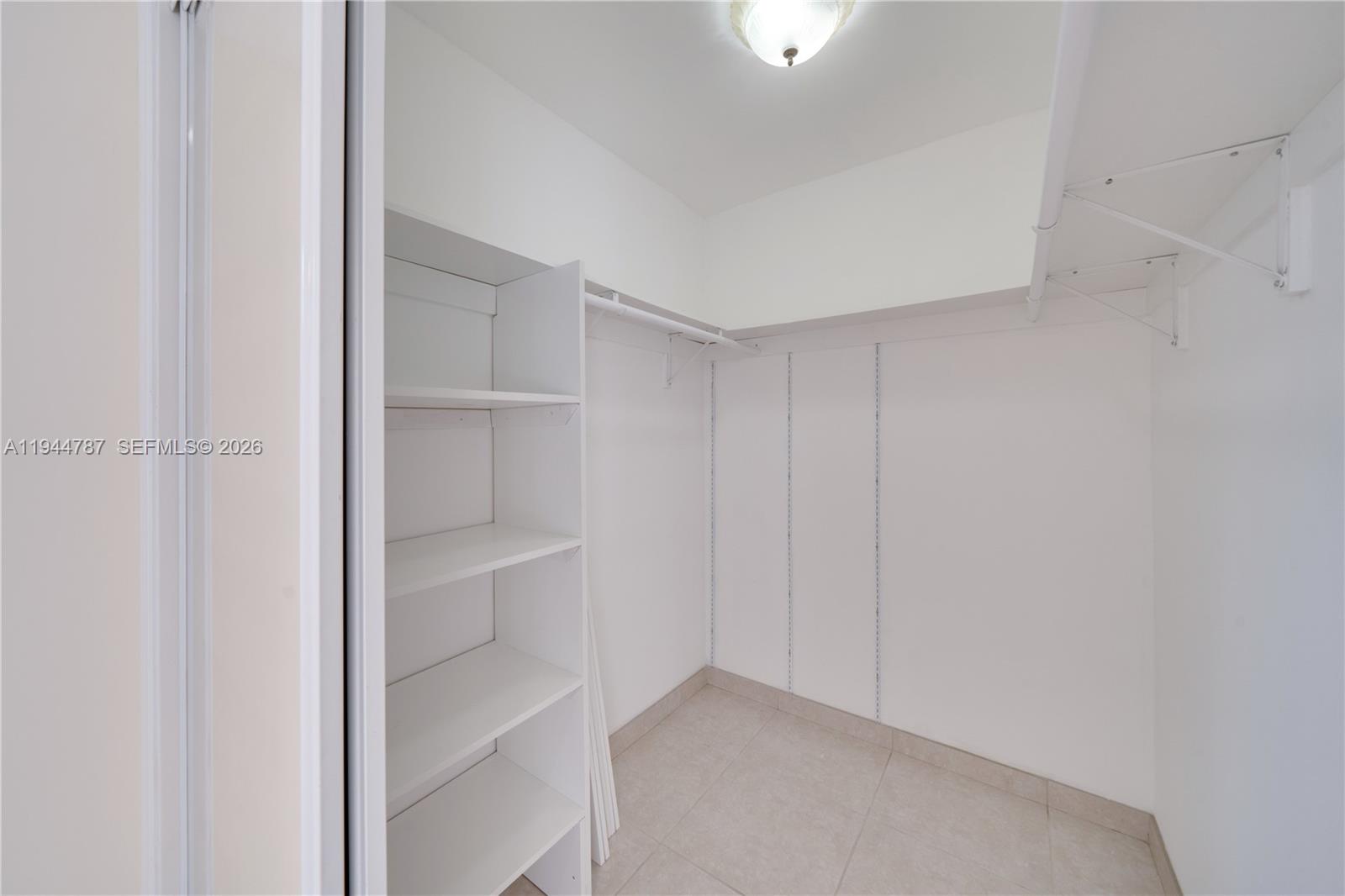 5524 Cleveland Street Hollywood, FL 33021 - Photo 31 of 36 a view of an empty walk in closet
