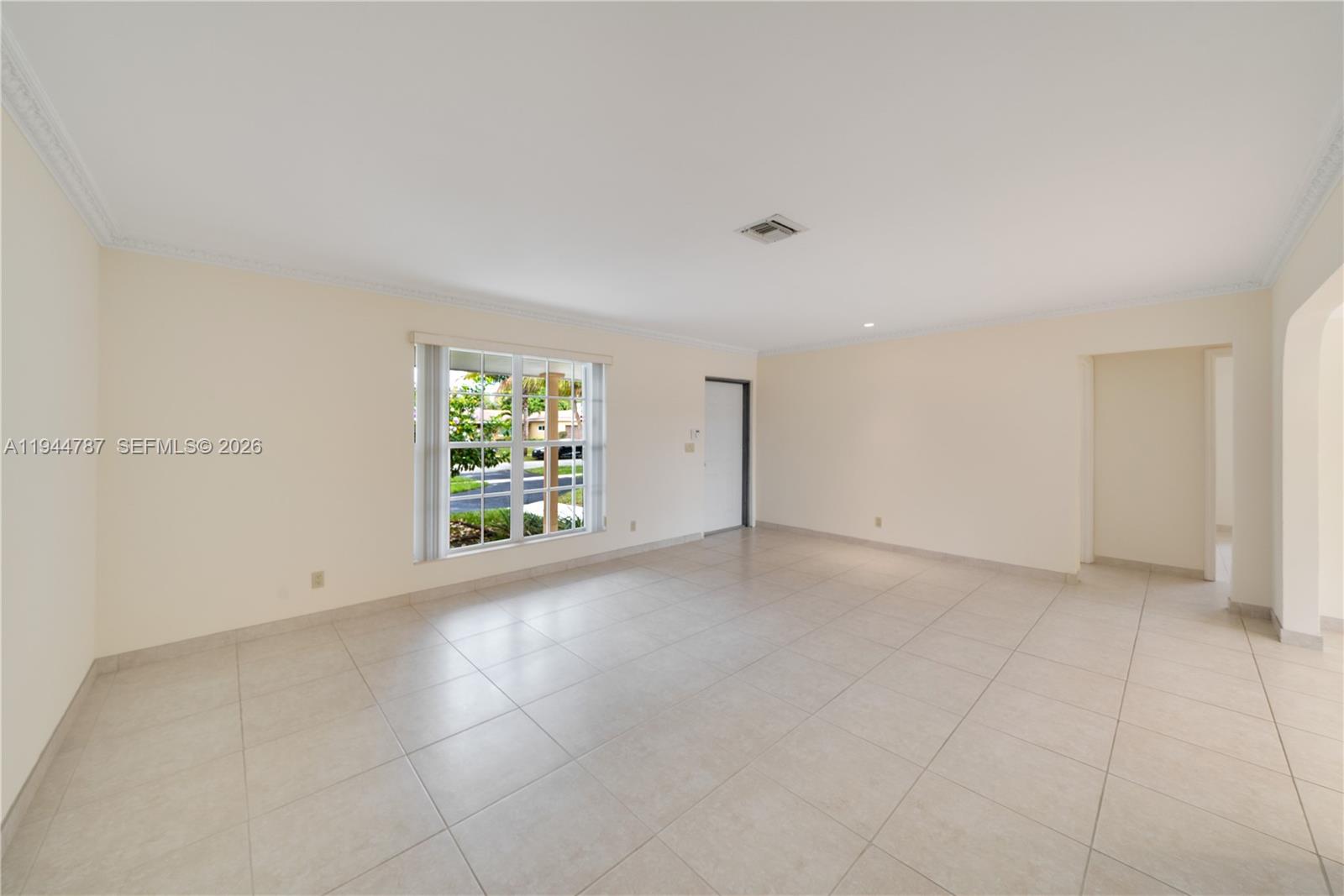 5524 Cleveland Street Hollywood, FL 33021 - Photo 9 of 36 an empty room with windows