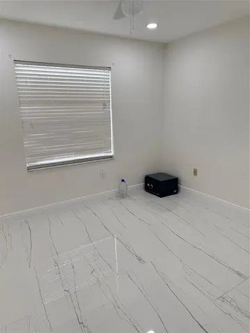 a view of empty room with closet