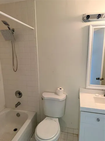 a bathroom with a toilet and a sink