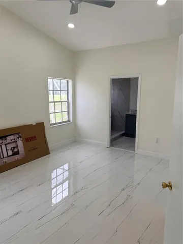 a view of an empty room and window
