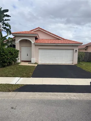 a front view of a house with a garage
