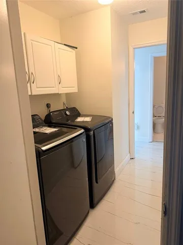 a utility room with washer and dryer