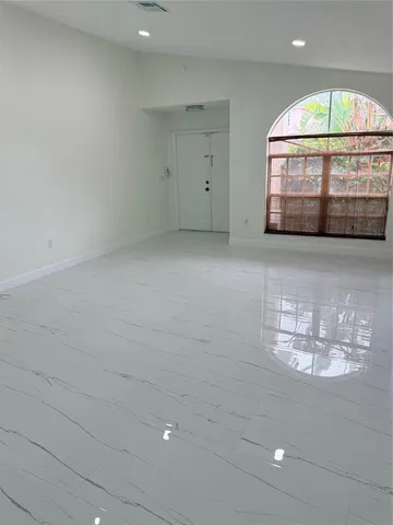 a view of water heater room with chandelier