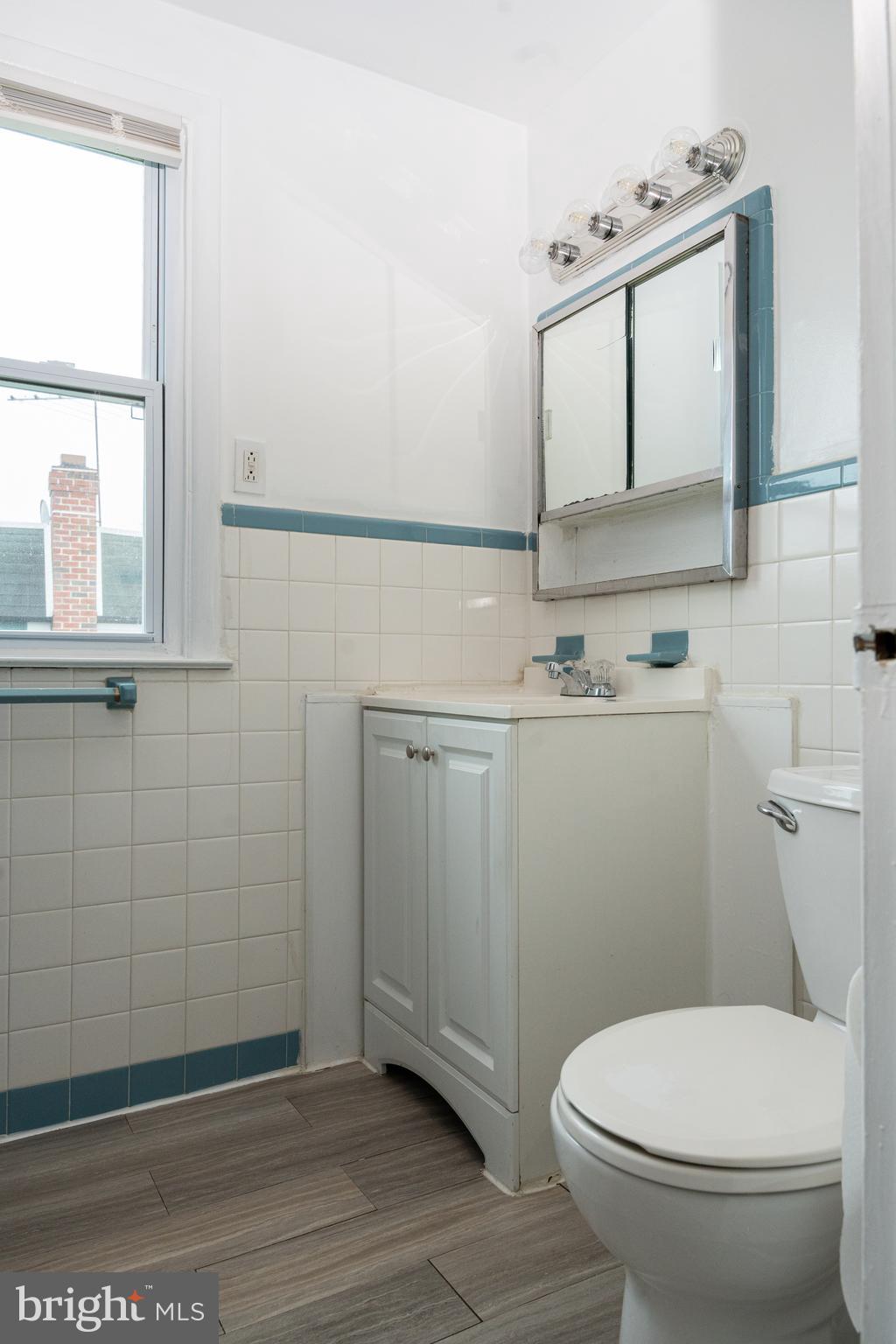 1151 Morefield Road Philadelphia, PA 19115 - Photo 10 of 22 a bathroom with a sink a toilet and mirror