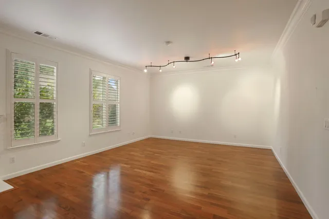 a living room with fireplace furniture and a wooden floor