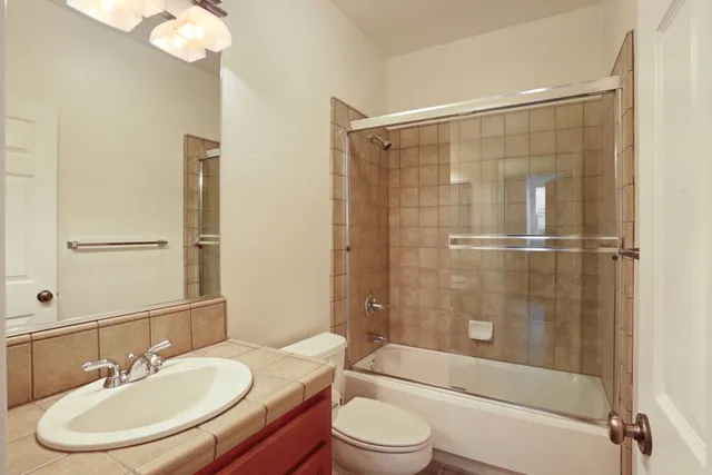 a view of empty room with wooden floor and fireplace