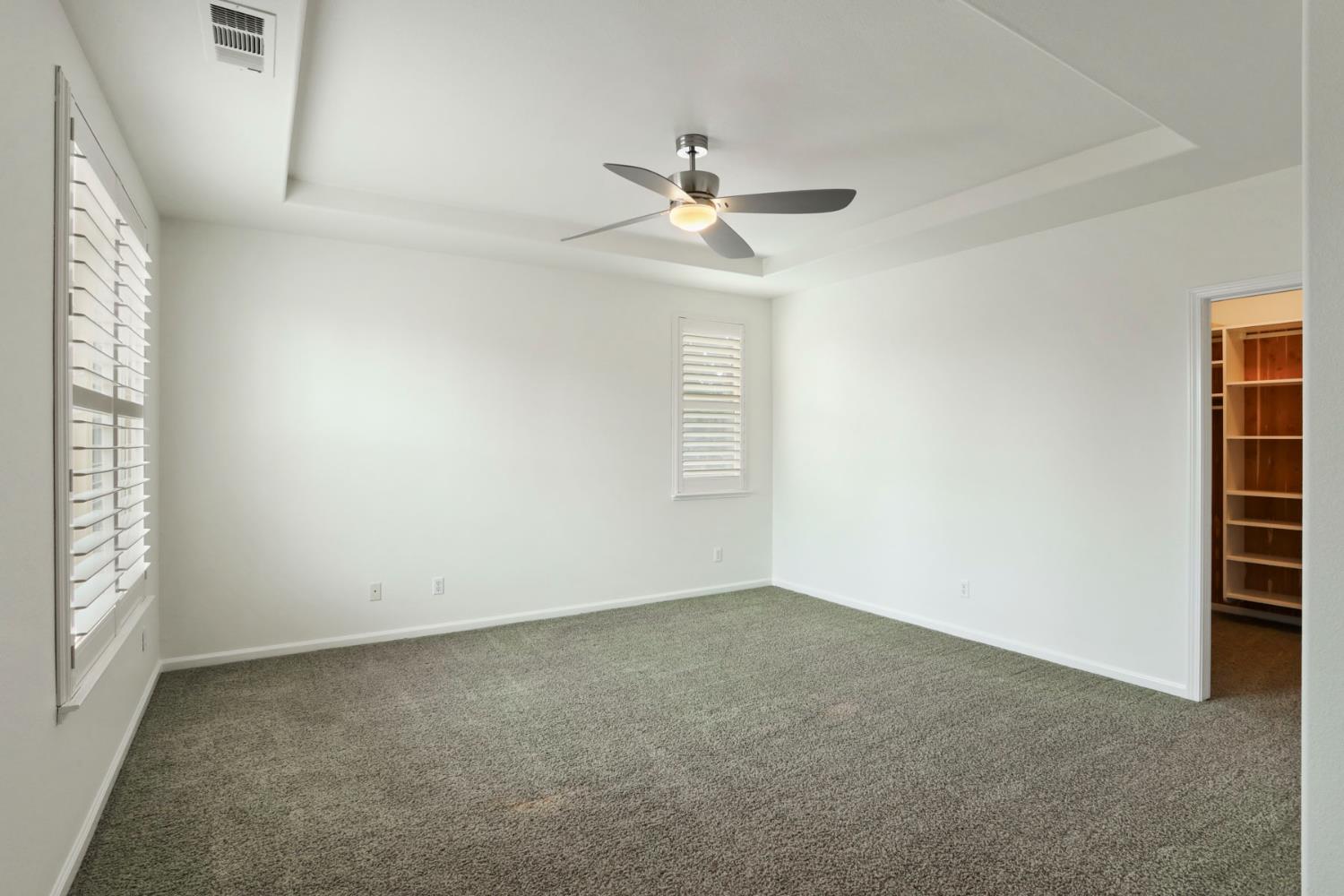 4305 Lourmarin Lane Modesto, CA 95356 - Photo 32 of 58 an empty room with closet and windows