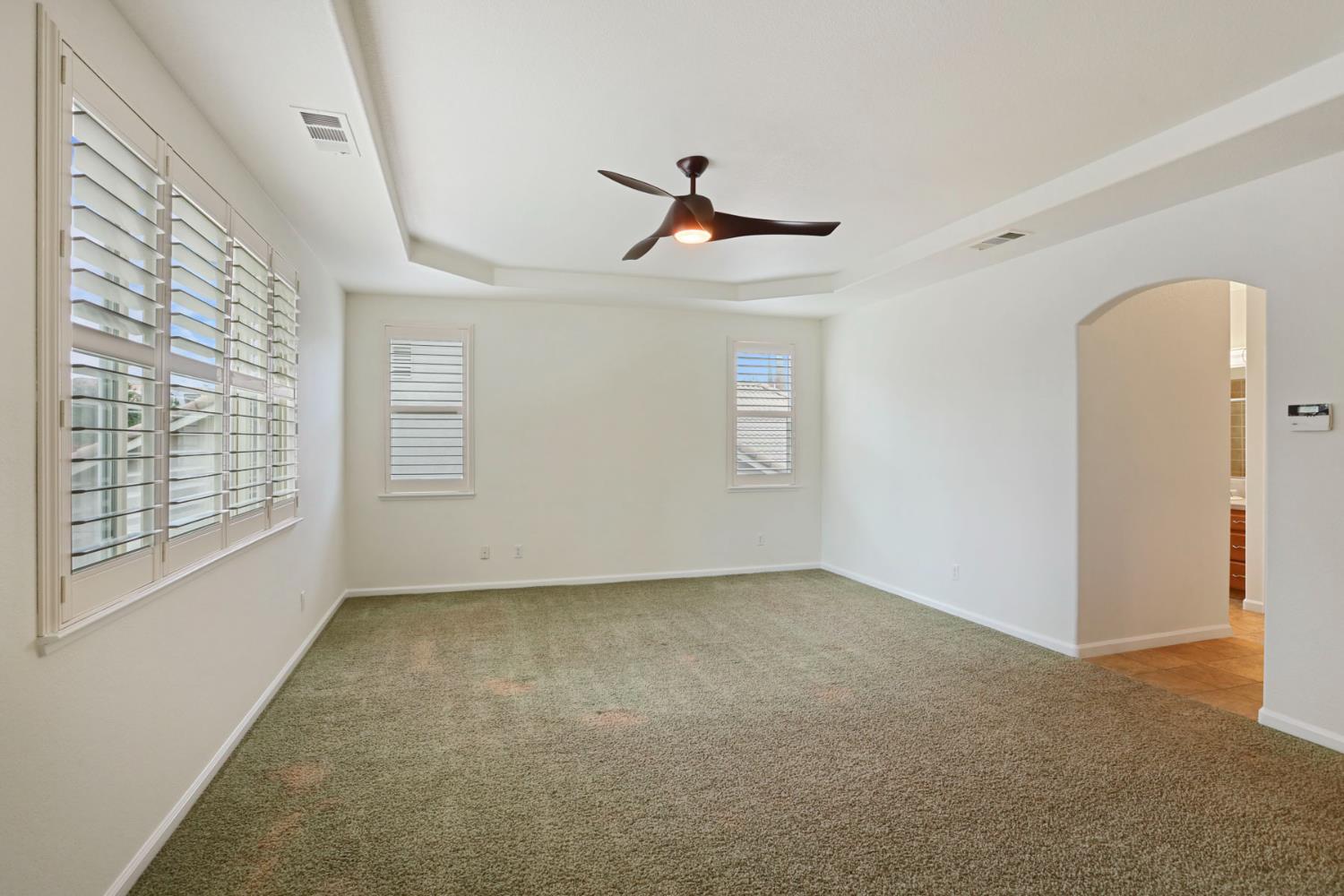 4305 Lourmarin Lane Modesto, CA 95356 - Photo 45 of 58 a view of empty room with windows